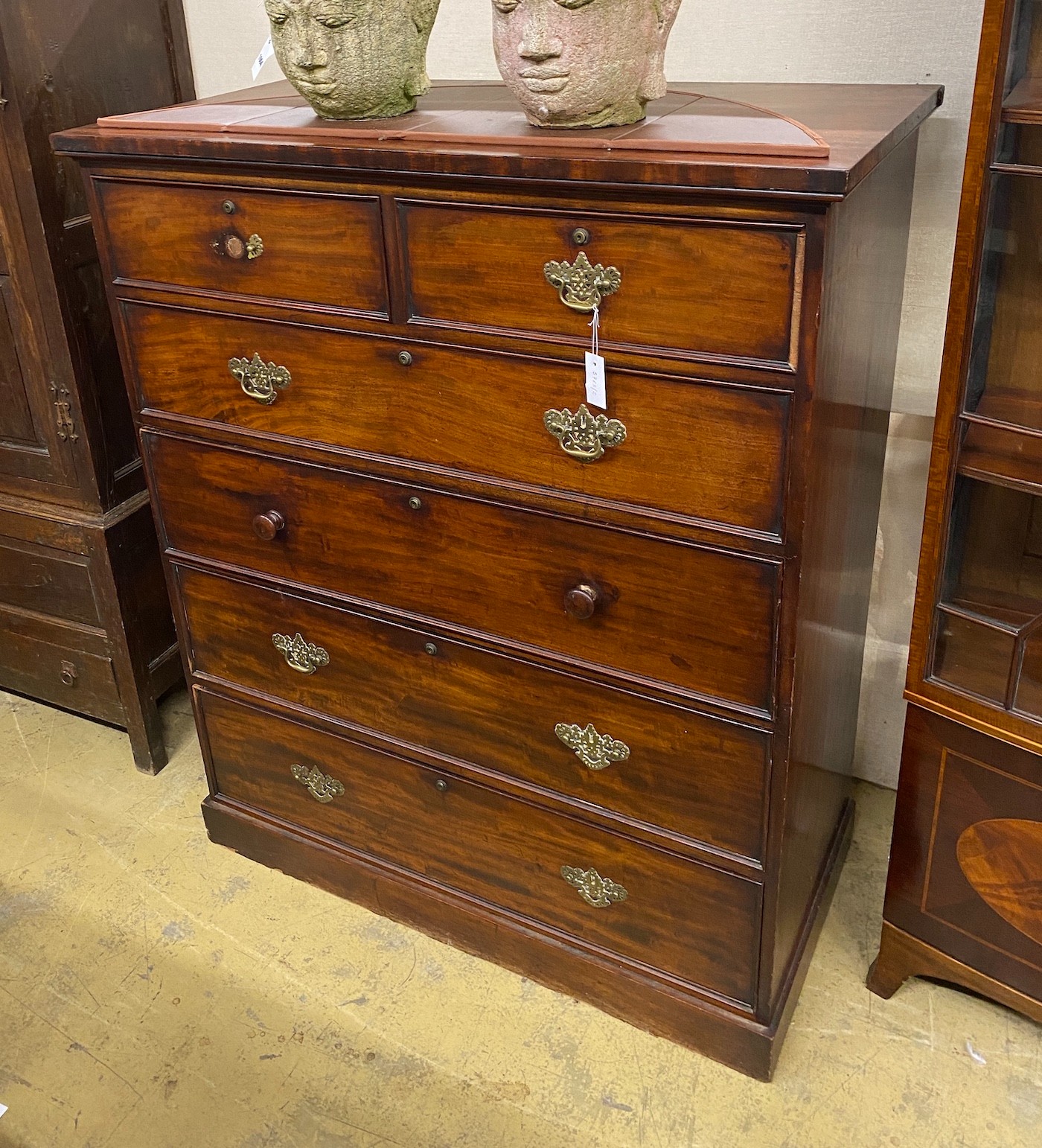 An early Victorian mahogany secretaire chest, fitted two short and four long drawers including a later converted drop front drawer, width 120cm, height 144cm